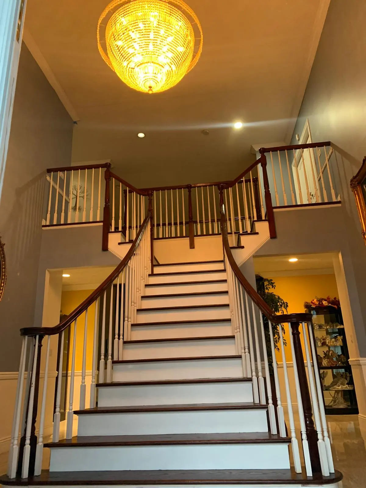 Custom wood hand railing installation on a staircase