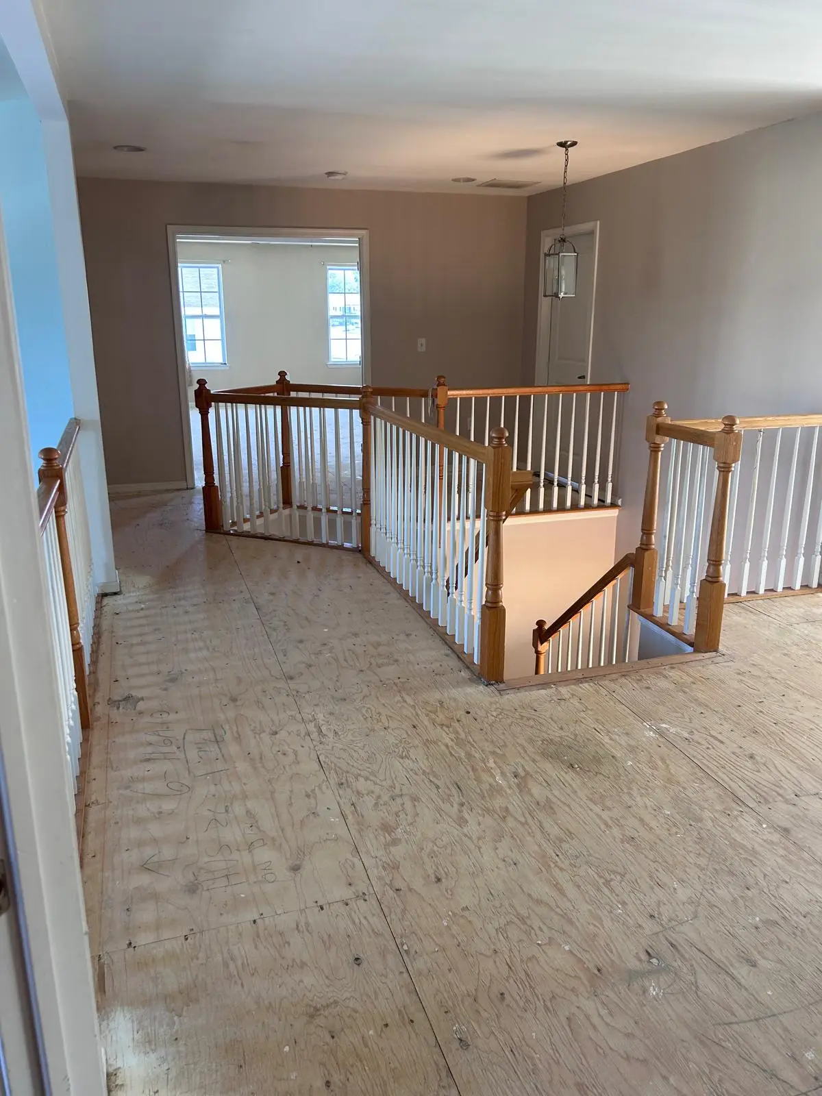 Wood staircase with custom hand railing installation