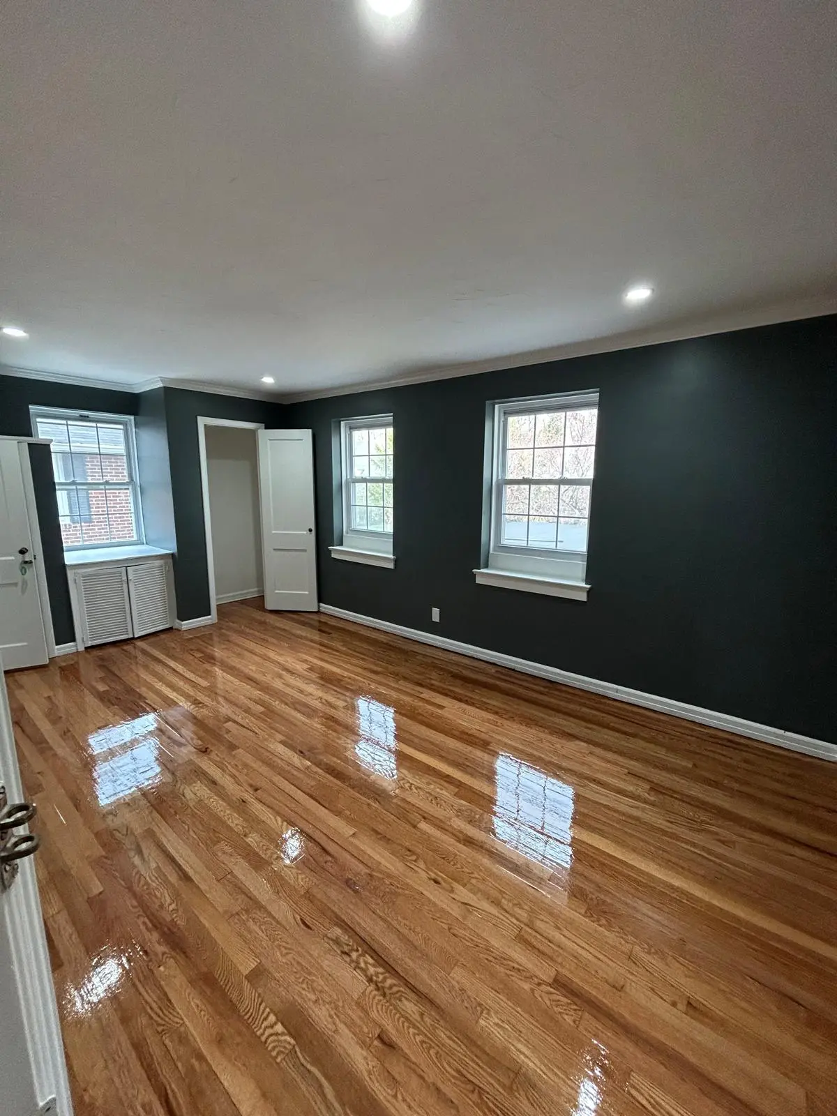 Refinished hardwood floor with a fresh glossy coat
