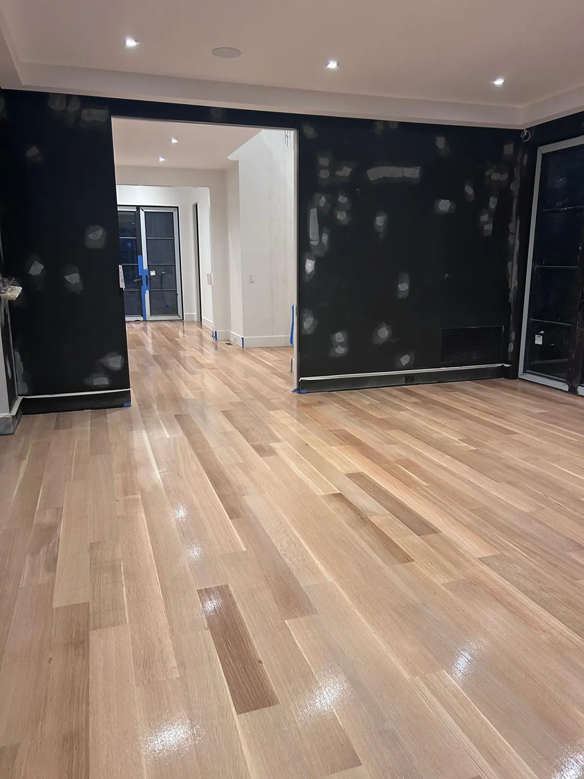 Freshly sanded hardwood floor ready for finishing